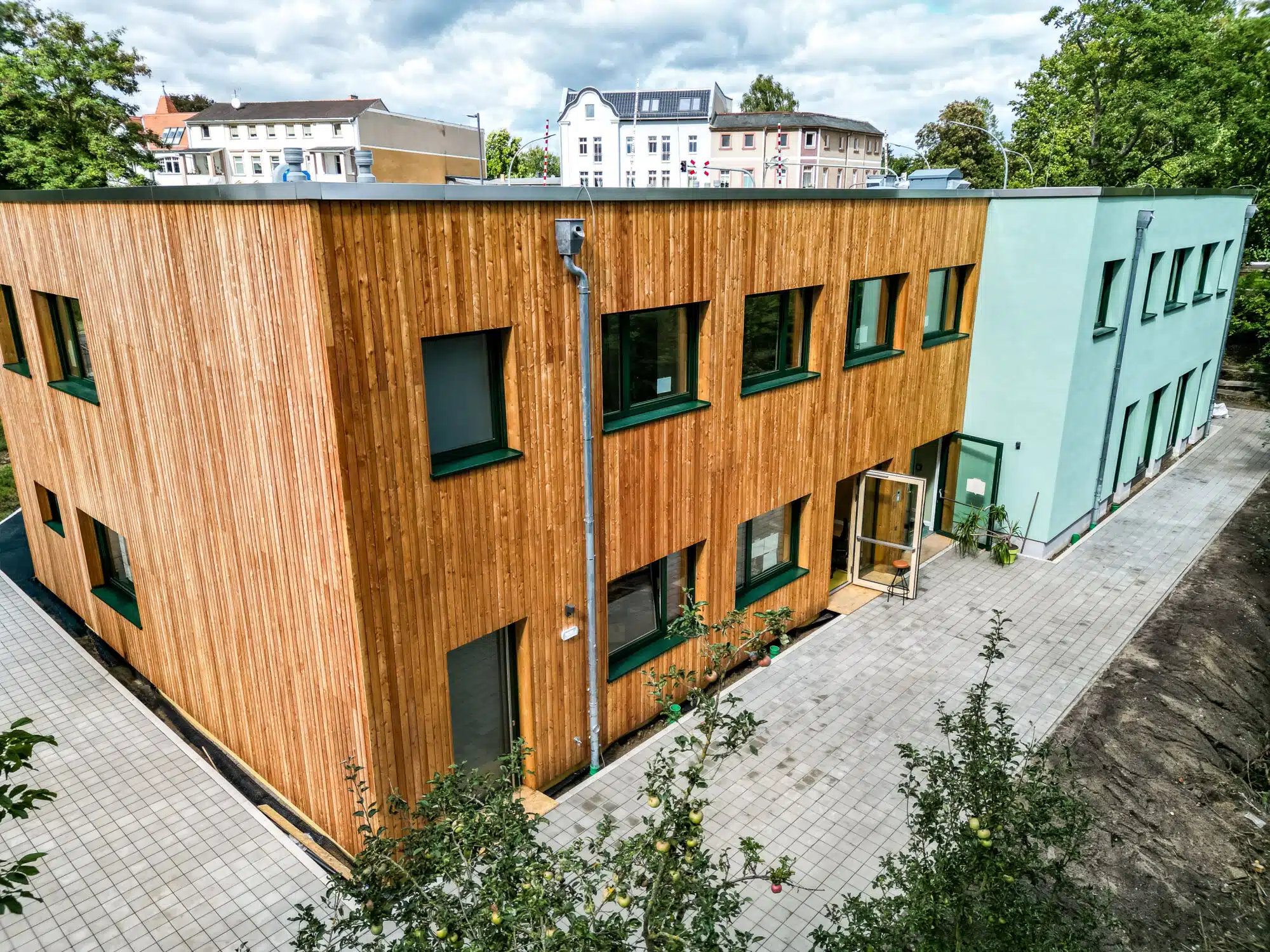 The timber-clad school building at Montessori Oberschule Strausberg, built where the school once had only tents.